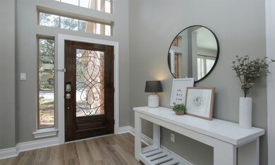 Opposite view of front entry facing the front glass door with wrought iron.