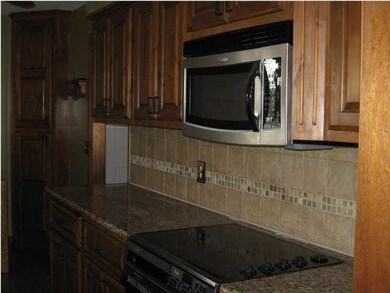 Kitchen granite counter top and tile back splash a