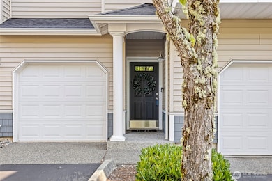 Single car garage with additional driveway space for another vehicle.