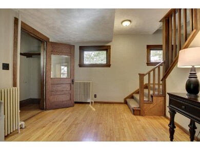 A large living room with leaded glass windows and 