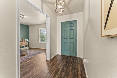 Foyer entrance featuring dark wood-type flooring 