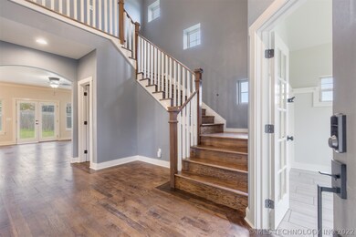 Soaring ceilings in the entry way, office just off