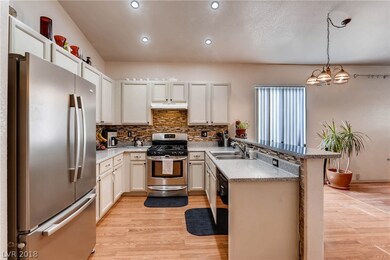 Upgraded kitchen with granite countertops and stai