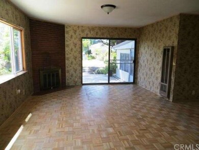 Spacious Family Room with Brick Fireplace.  
