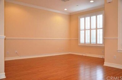 Living room with laminated wood flooring, recessed