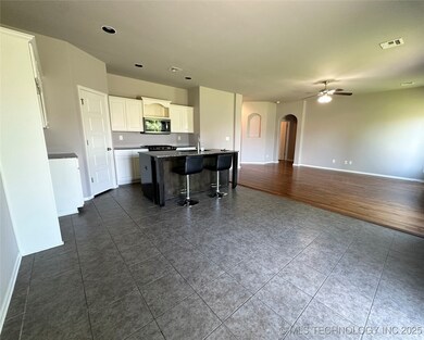 Kitchen with arched walkways, stainless steel micr