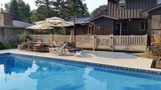 A view of the built in pool and patio