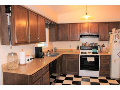 The stove in the kitchen has a gas stove top, and 