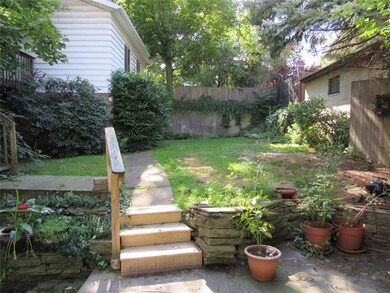 The completely fenced back yard is perfect for kid
