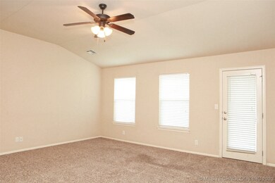 Vaulted family room is very light and bright