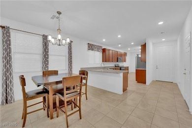 Dining area with light tile patterned flooring, a