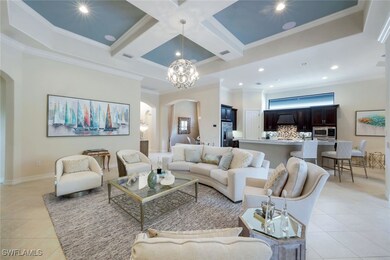 Living room with arched walkways, light tile patte