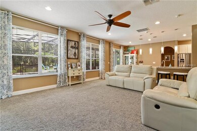 Formal Living Room with views to the back yard and pool