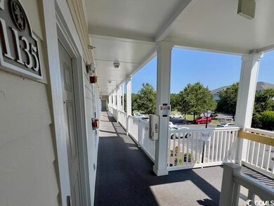Exterior entry is well lit with covered porch