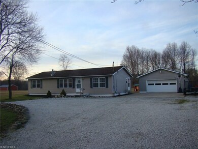Plenty of parking. Huge garage with concrete skirt