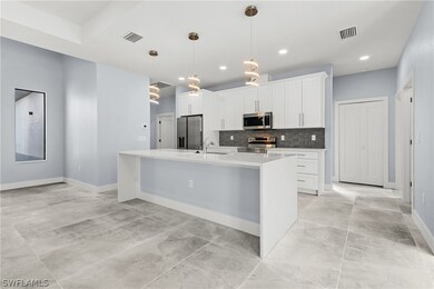 Kitchen featuring decorative light fixtures, light