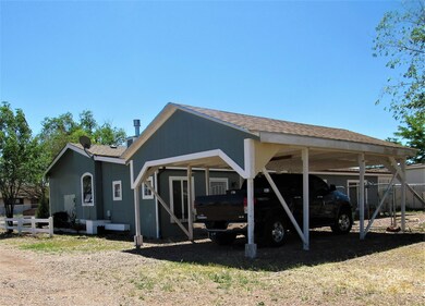 Carport behind house