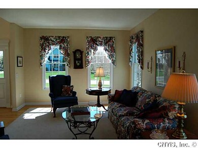 Living Room. To the left of the entry room is a co