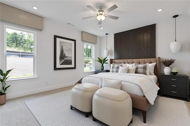 Bedroom with ceiling fan and recessed lighting