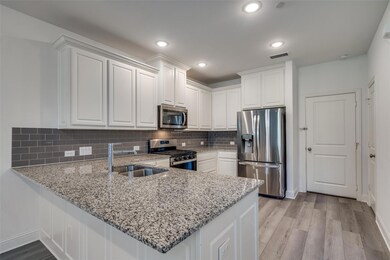 Granite counters, stainless steel appliances, and 