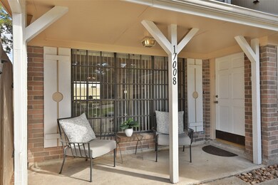FRONT PORCH:  Board and batten shutters flanking t