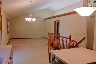 Great room has cathedral ceiling and unique lighti
