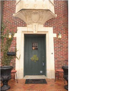 Original stonework and solid wood door with leaded
