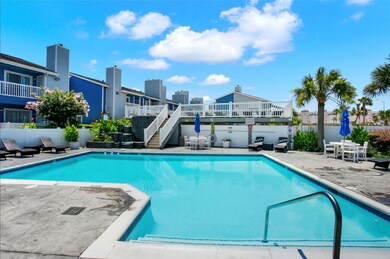 Gorgeous community pool with waterfall and upper s