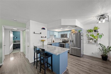 Kitchen featuring a breakfast bar area, blue cabin
