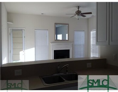 Den/Family/Great Room. Fireplace view from kitchen