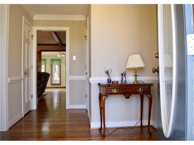 Foyer with coat closet and Powder room