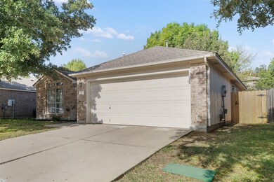 View of front of house with concrete driveway, br