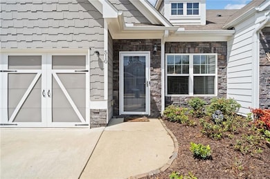 Property entrance with stone siding