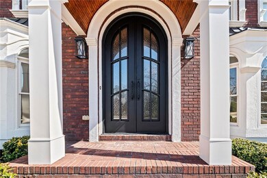 Doorway to property featuring brick siding and fre
