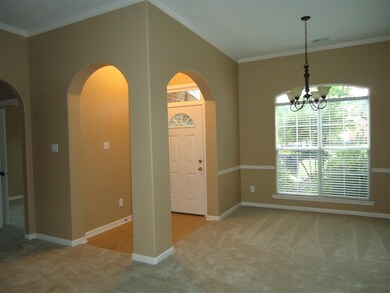 Great open foyer with tile, Pella storm door  Dining room opens to the greatroom