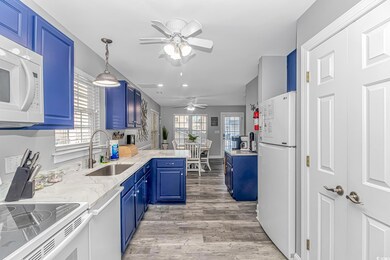Kitchen with decorative light fixtures, sink, kitc