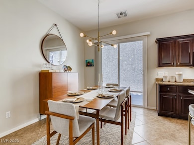 Dining room featuring light tile patterned floors,