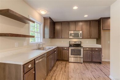 Kitchen has lots of cabinets!  Open shelving is an