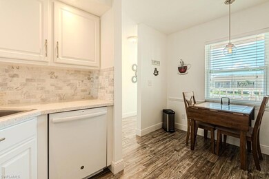 Living room with high vaulted ceiling, hardwood / 
