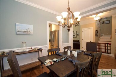 Formal dining room with hardwood floors, off of fo