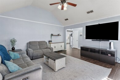 Living room with wood finished floors, a ceiling fan, and high vaulted​​‌​​​​‌​​‌‌​​‌​​​‌‌​​​​​​‌‌‌​​‌​​‌‌​​​‌ ceiling