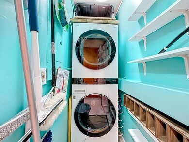 Laundry room with estacked washer and dryer