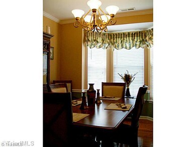 Dining Room. Hardwoods with new light fixture and bay window