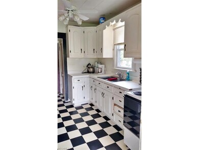 Bright Kitchen with black and white vinyl floor