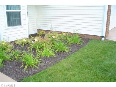 Exterior Front - SHRUBBERY AND FLOWERS BY HOA...YO