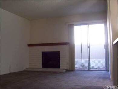 LIVING ROOM WITH SLIDING DOOR TO PATIO