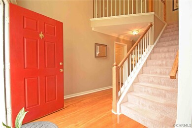two-story entrance foyer with balcony above.