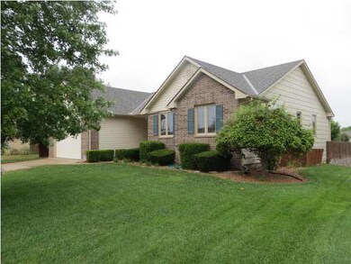 Another view of the home. Beautiful mature trees. 