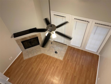 Kitchen with white cabinets, light tile patterned 