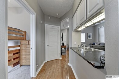 Leads to living area, kitchen, laundry room, and second bedroom